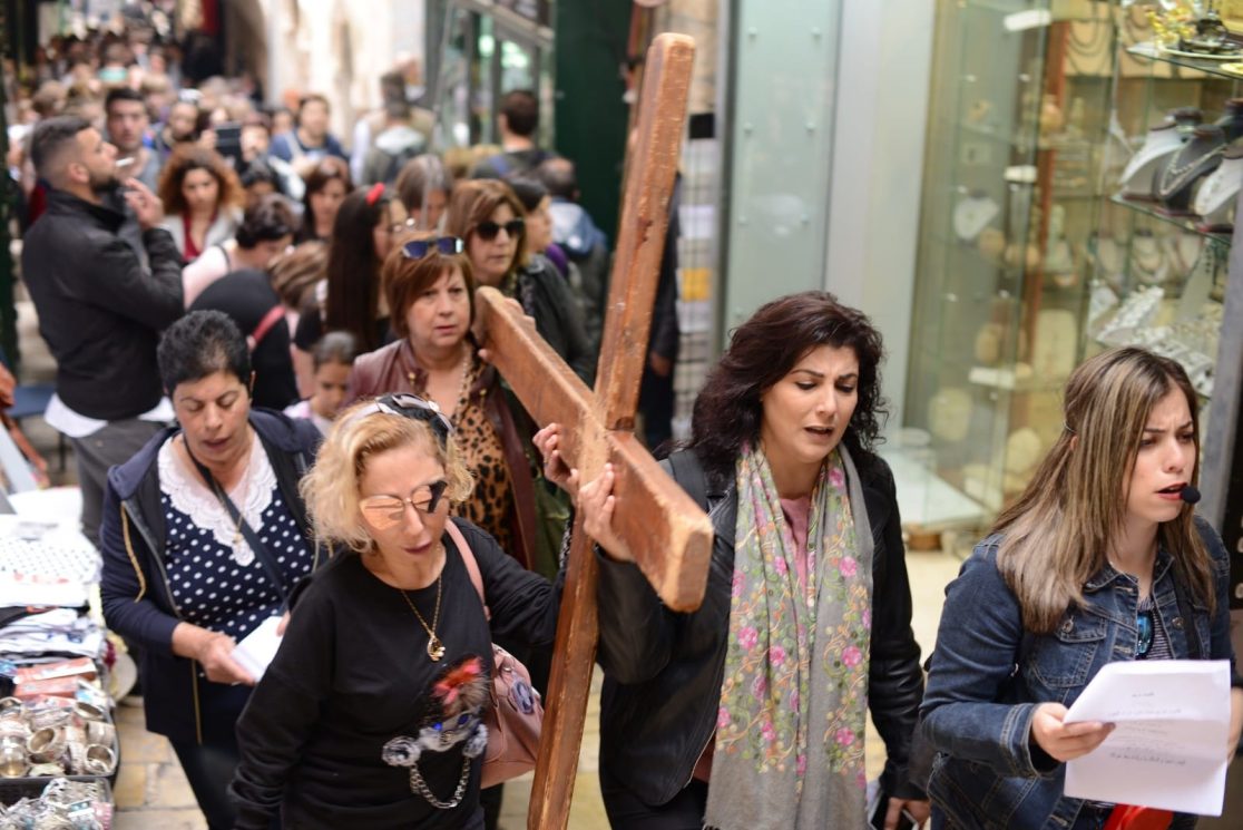 Carring the cross at the Via Dolorosa in Jerusalem old city