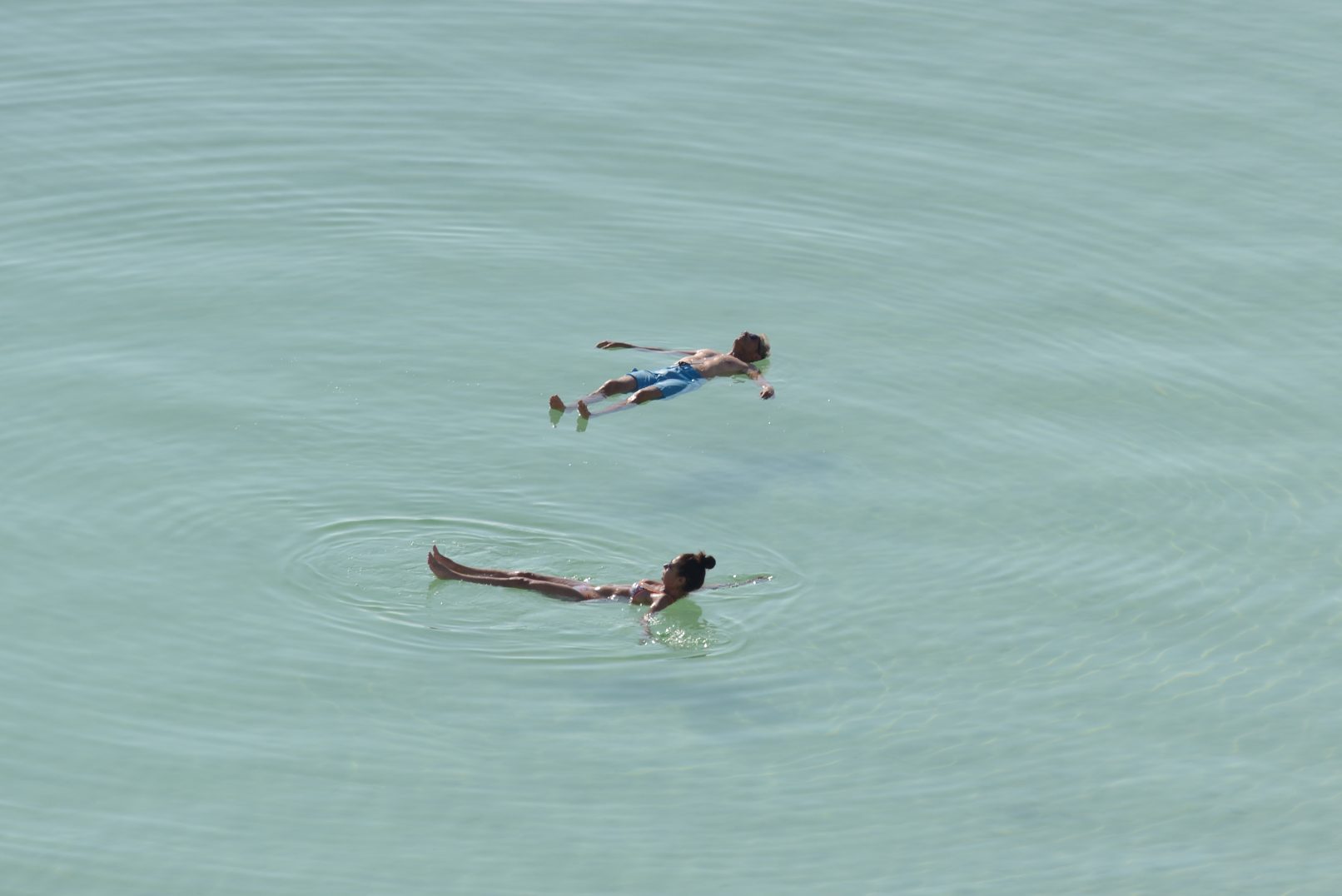 People floating at the Dead Sea waters