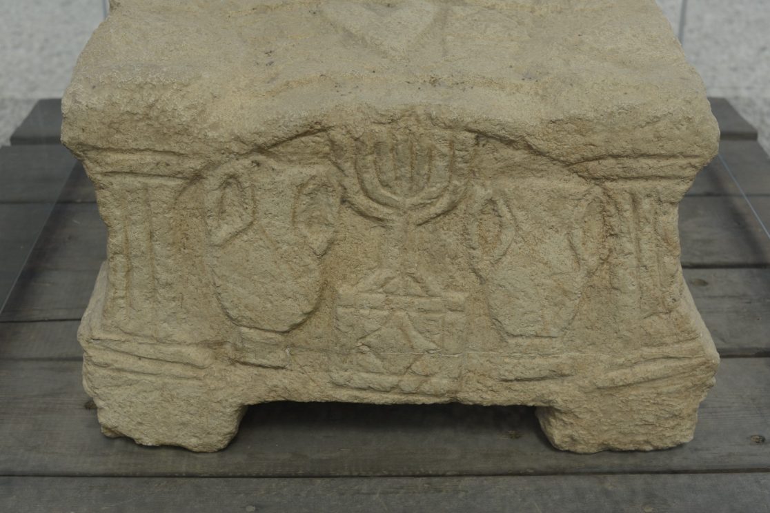Magdala synagogue Rosette stone with seven branched menorah symbol