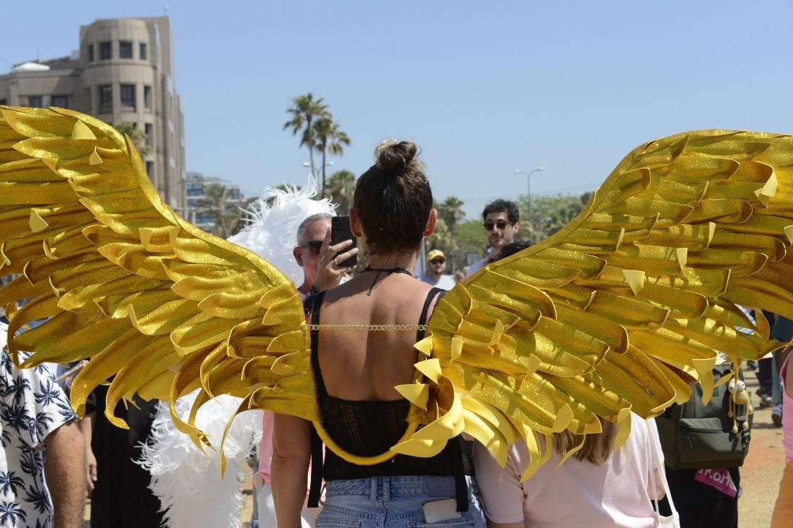 A woman with golden wings at the 2026 Tel Aviv Gay Pride Parade