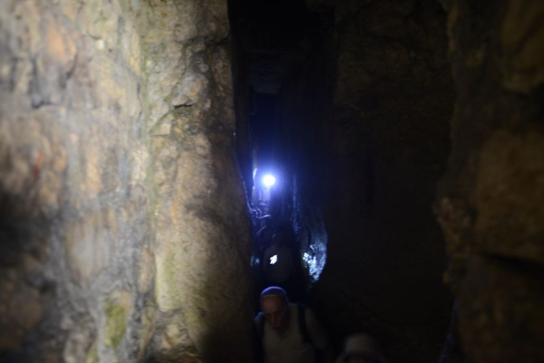 Hezekiah's Tunnel is an ancient subterranean water passage carved through solid bedrock during the in the late 8th century BC