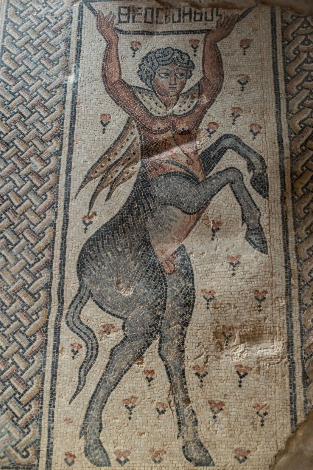 A Centaur, the mythological half-man, half-horse , with the inscription “Friend of God.”